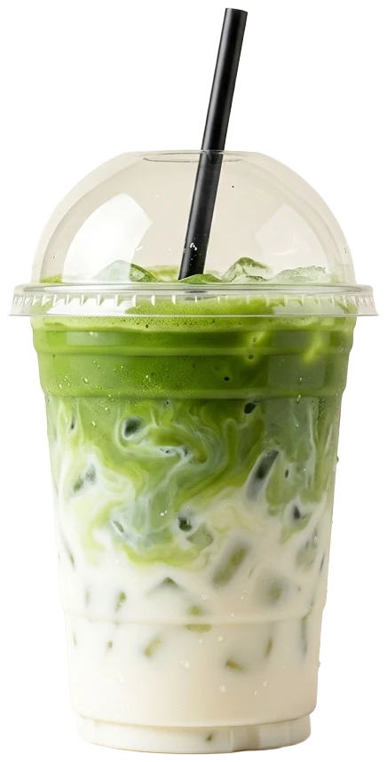 Iced matcha latte in a clear domed cup, green matcha swirling into milk
