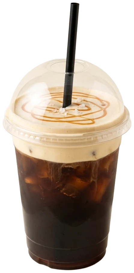 Salted caramel cold brew in a clear domed cup, topped with caramel cold foam