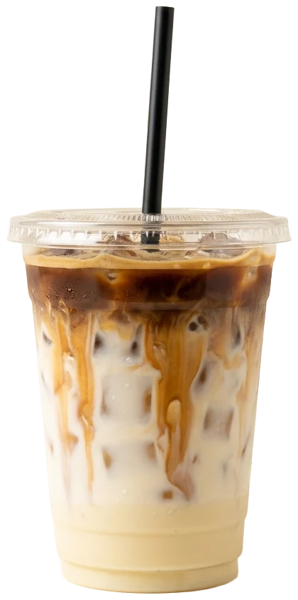 Iced Spanish latte in a clear cup, espresso swirling down into condensed milk